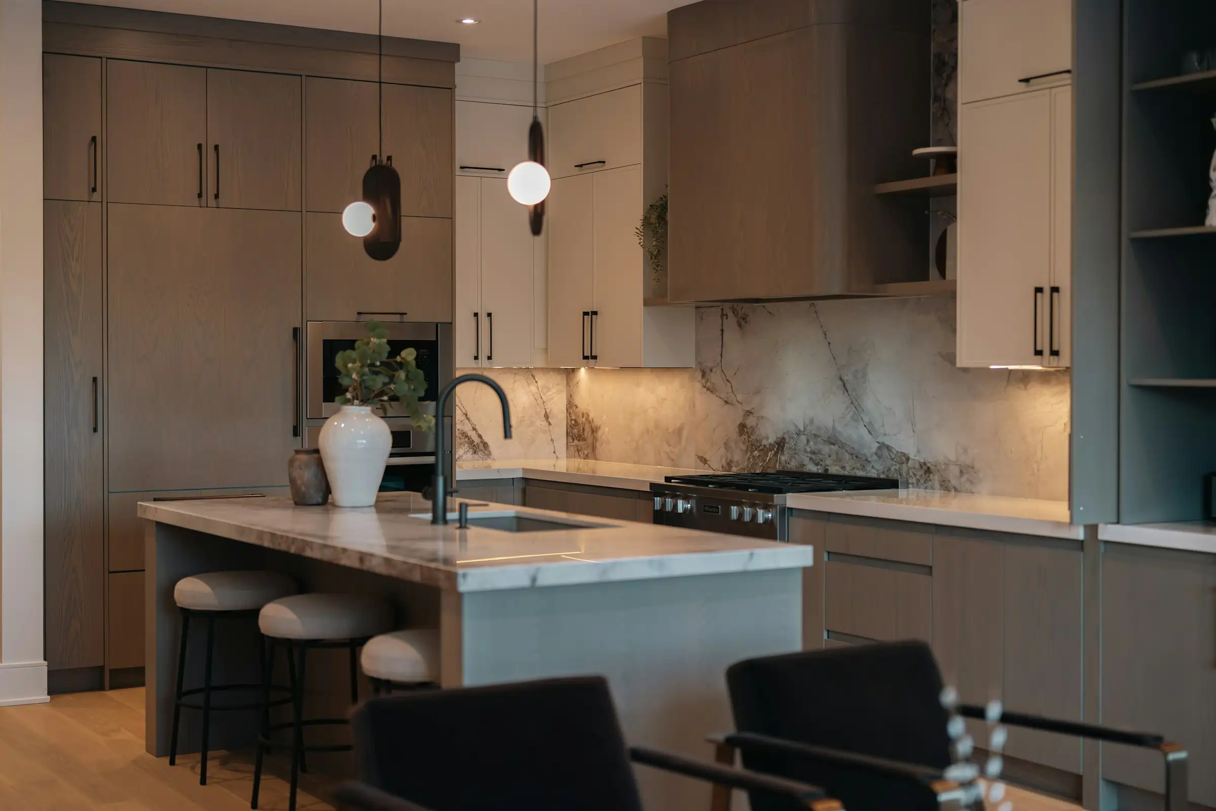 Kitchen cabinet remodel with soft-close cabinets and hanging lights above the counter