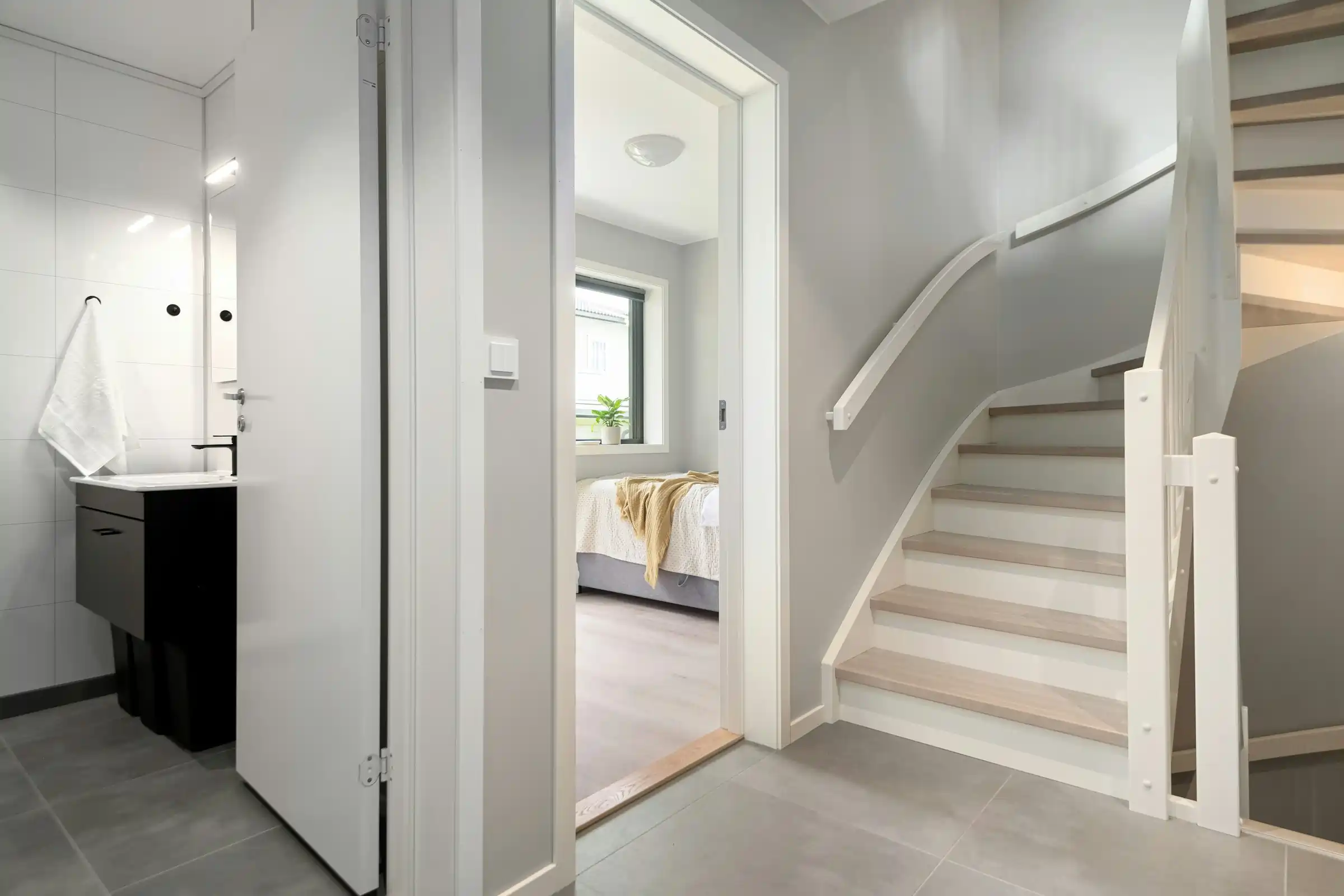 White carpentry trim installed around doorways and stair transitions