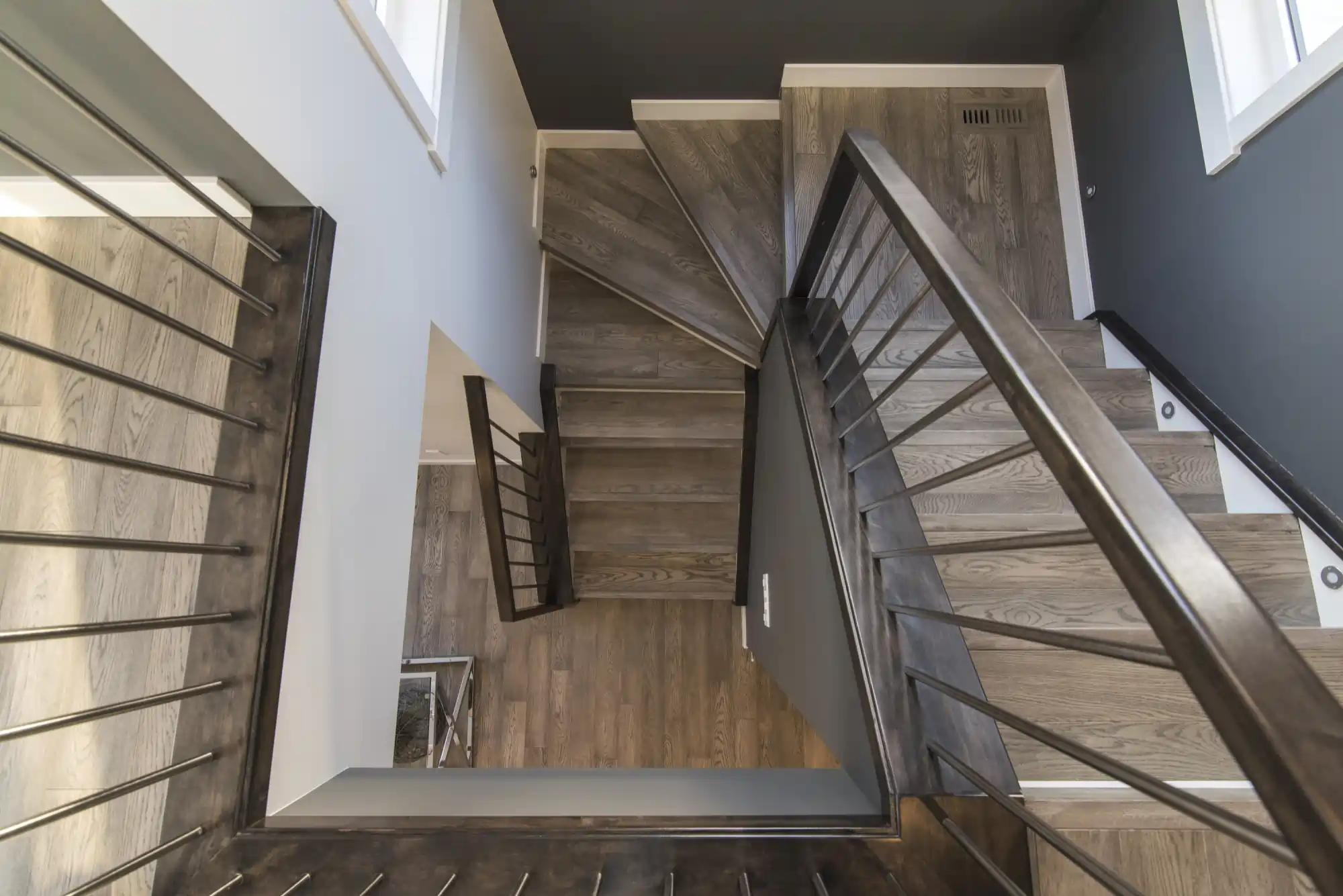 Stair trim remodel with gray finish matched to surrounding aesthetic