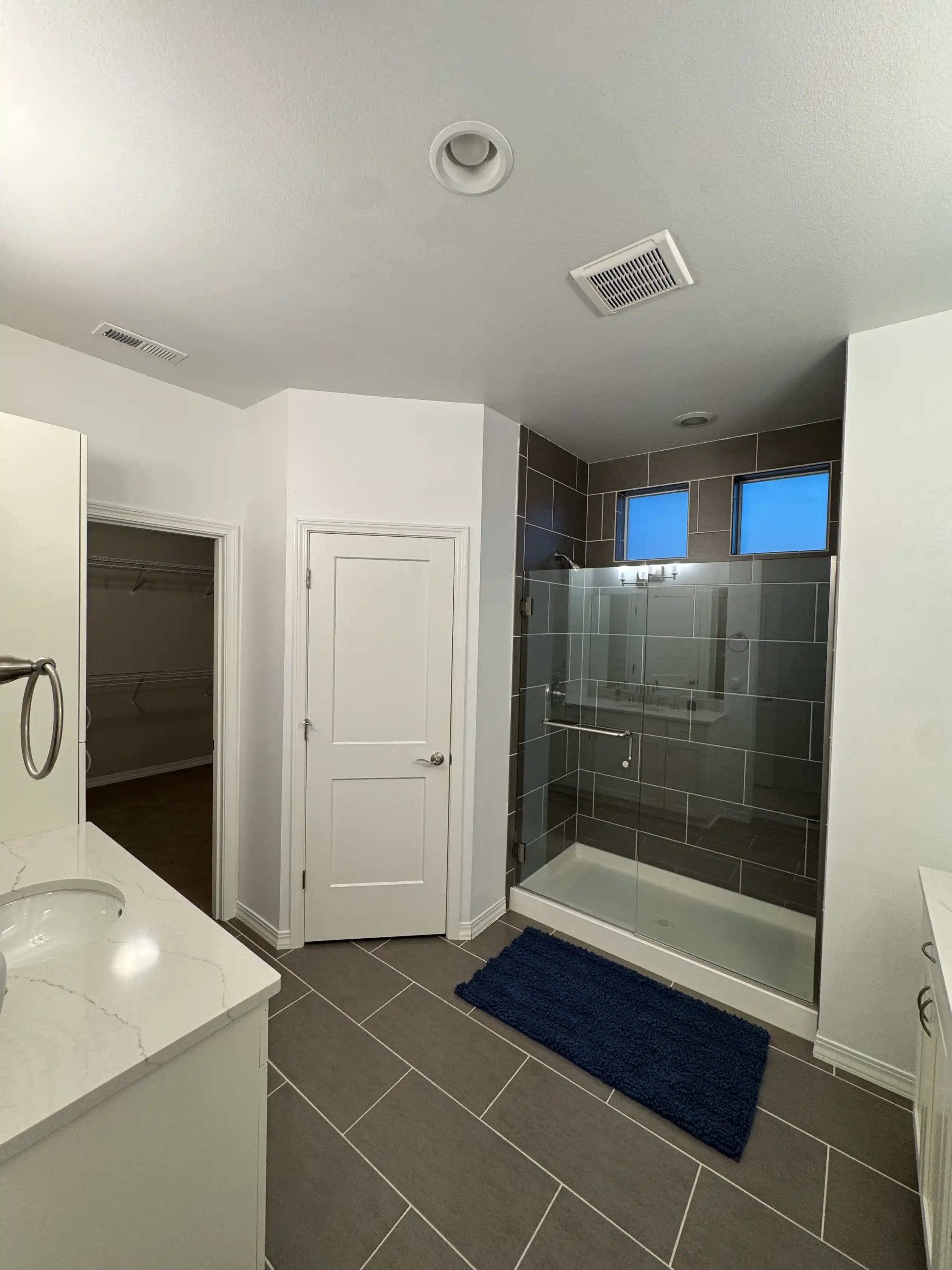 Full bathroom remodel with new flooring, shower, and bathroom cabinets